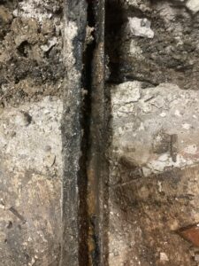 Plumber inspecting home water pressure