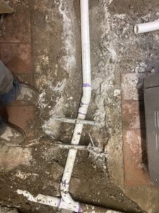 Technician inspecting underground sewer line