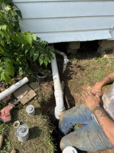 Local plumber tightening pipe fittings