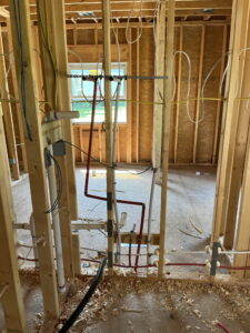 plumbing installation in house framing